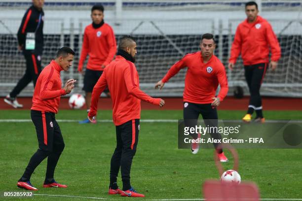 Alexis Sanchez, Arturo Vidal and Charles Aranguiz attend a Chile training session ahead of their FIFA Confederations Cup Russia 2017 final against...