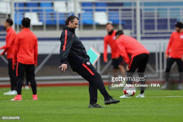 Head coach Juan Antonio Pizzi kicks the ball during a Chile training session ahead of their FIFA Confederations Cup Russia 2017 final against Germany...