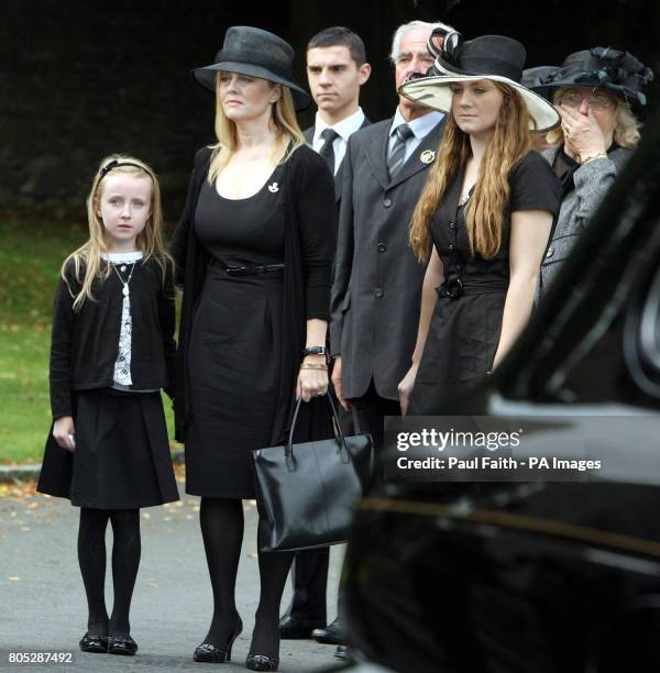 Brenda Hale at the funeral of her husband Captain Mark Hale in Hillsborough Co Down, with her two daughters Alex and Tori .