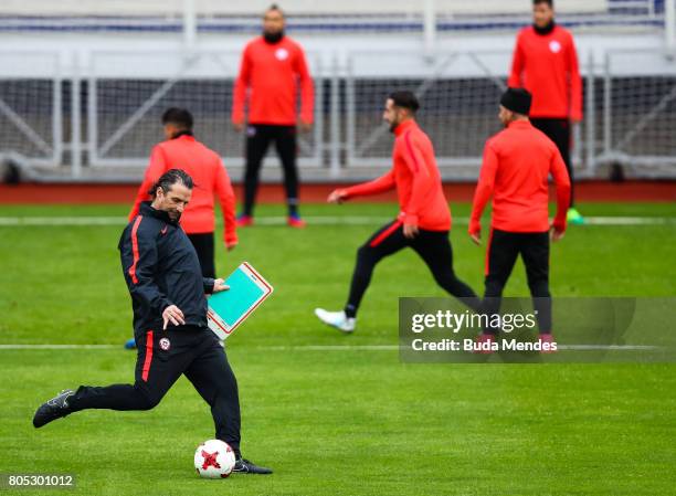 Head coach Juan Antonio Pizzi kicks the ball during a Chile training session ahead of their FIFA Confederations Cup Russia 2017 final against Germany...