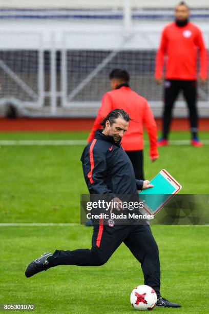 Head coach Juan Antonio Pizzi kicks the ball during a Chile training session ahead of their FIFA Confederations Cup Russia 2017 final against Germany...