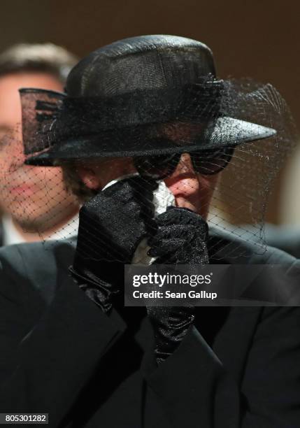 Maike Kohl-Richter, the widow of former German Chancellor Helmut Kohl, dabs an eye prior to a requiem for Kohl at the Speyer cathedral on July 1,...