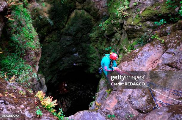 Speleologist in the abyss of Golgo. Su Sterru. Baunei. Ogliastra. Sardinia. Italy. Europe.