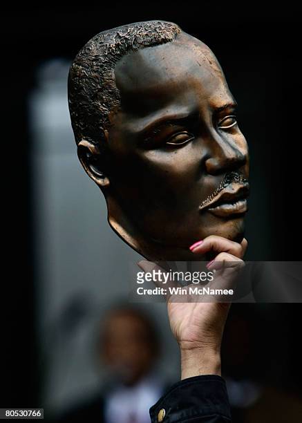 Participant in the rally prior to the "Recommitment March" holds up a bust of Martin Luther King Jr. April 4, 2008 in Memphis, Tennessee. King was...