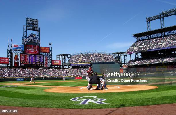 Starting pitcher Mark Redman of the Colorado Rockies delivers the first pitch of the game to Chris Young of the Arizona Diamondbacks on opening day...
