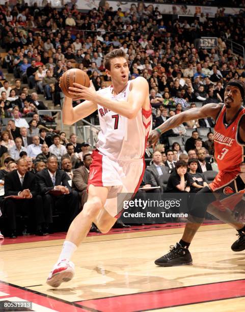Andrea Bargnani of the Toronto Raptors drives baseline against Gerald Wallace of the Charlotte Bobcats at the Air Canada Centre April 4, 2008 in...