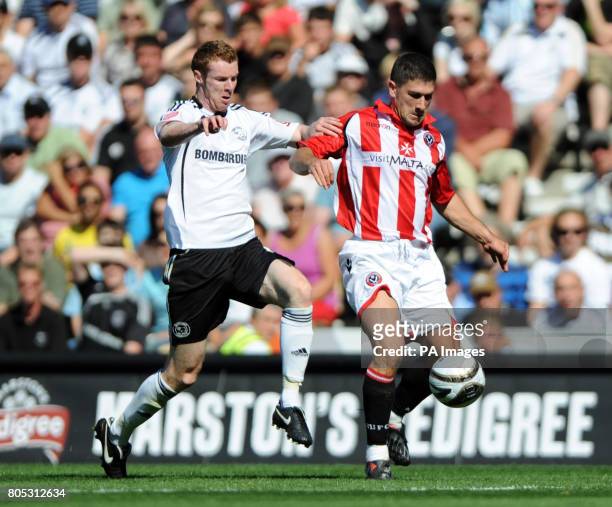 Derby County's Stephen Pearson and Sheffield United's Nick Montgomery battle for the ball during the Coca-Cola Championship match at Pride Park,...