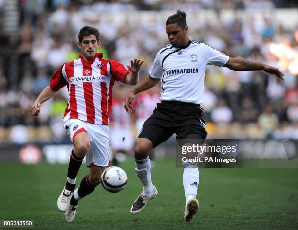 Sheffield United's Ched Evans and Derby County's Dean Leacock battle for the ball during the Coca-Cola Championship match at Pride Park, Derby.