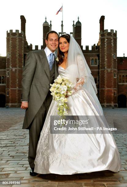 Lord Freddie Windsor poses with his bride Sophie Winkleman in the Base Court, minutes after their wedding in the Chapel Royal at Hampton Court Palace...