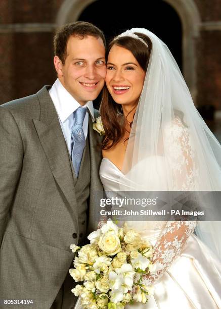 Lord Freddie Windsor poses with his bride Sophie Winkleman in the Base Court, minutes after their wedding in the Chapel Royal at Hampton Court Palace...