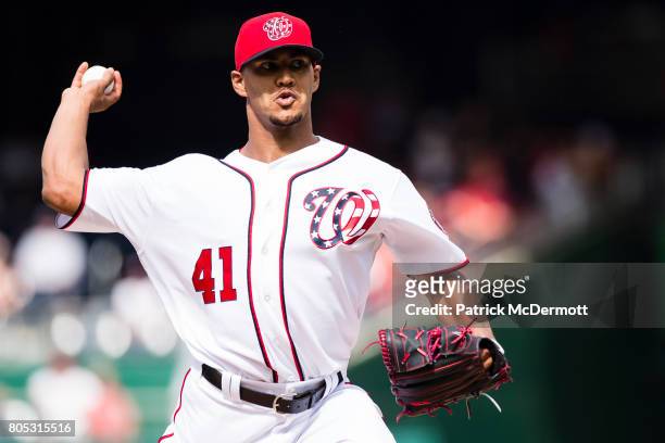 Starting pitcher Joe Ross of the Washington Nationals throws a pitch to a Cincinnati Reds batter in the first inning during a game at Nationals Park...