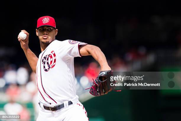 Starting pitcher Joe Ross of the Washington Nationals throws a pitch to a Cincinnati Reds batter in the first inning during a game at Nationals Park...