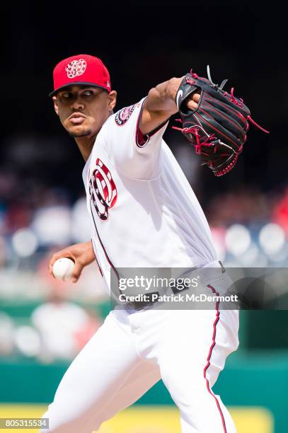 Starting pitcher Joe Ross of the Washington Nationals throws a pitch to a Cincinnati Reds batter in the first inning during a game at Nationals Park...