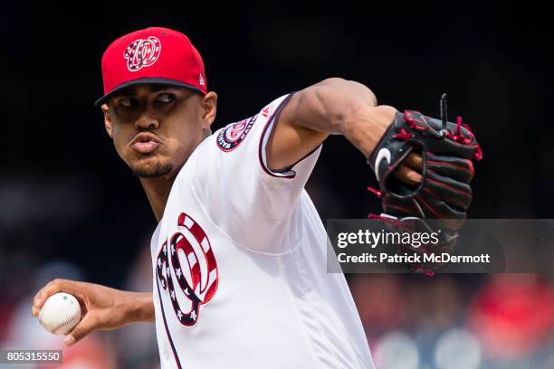 Starting pitcher Joe Ross of the Washington Nationals throws a pitch to a Cincinnati Reds batter in the first inning during a game at Nationals Park...