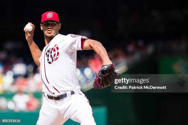 Starting pitcher Joe Ross of the Washington Nationals throws a pitch to a Cincinnati Reds batter in the first inning during a game at Nationals Park...