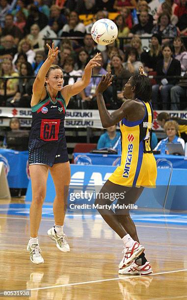 Sharelle McMahon captain of the Vixens makes a pass with Sonia Mkoloma of the Pulse in defence during the round one ANZ Championship match between...