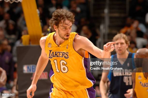 Pau Gasol of the Los Angeles Lakers gestures to a teammate after scoring a basket during the game against the Dallas Mavericks at Staples Center...