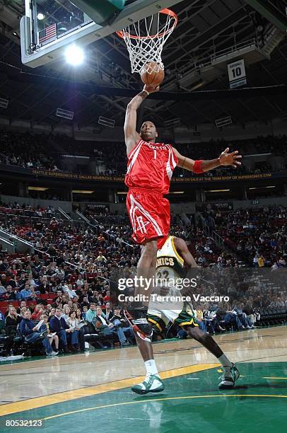 Tracy McGrady of the Houston Rockets goes to the basket past the defense of Jeff Green of the Seattle SuperSonics on April 4, 2008 at the Key Arena...