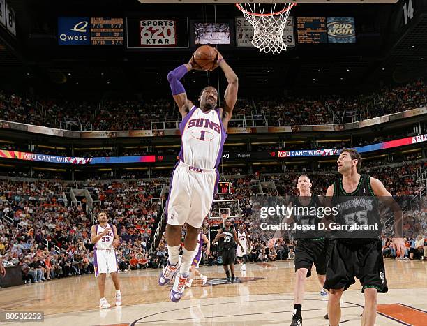 Amare Stoudemire of the Phoenix Suns dunks against Marko Jaric of the Minnesota Timberwolves during the game on April 4, 2008 at the US Airways...