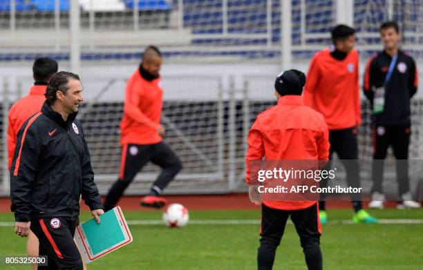 Chile's head coach Juan Antonio Pizzi looks on during a training session in Saint Petersburg on July 1, 2017 on the eve their 2017 FIFA...