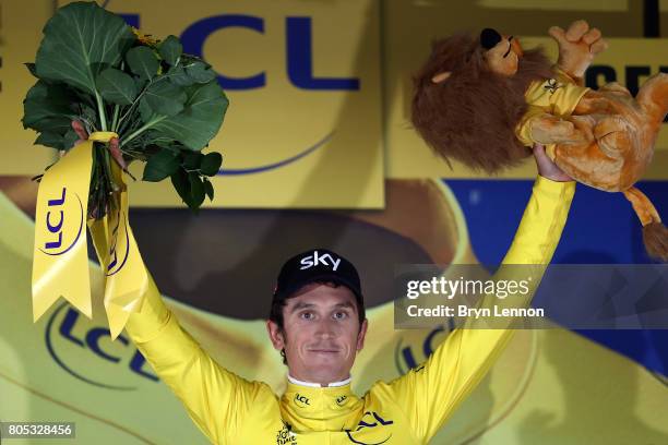 Geraint Thomas of Great Britain and Team SKY celebrates winning the first stage and taking the race leaders yellow jersey after stage one of the 2017...