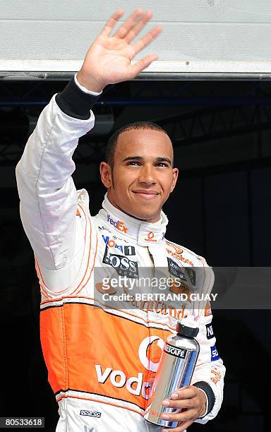 McLaren-Mercedes British driver Lewis Hamilton waves to supporters at the Sakhir racetrack, on April 05, 2008 in Manama, after the qualifying session...