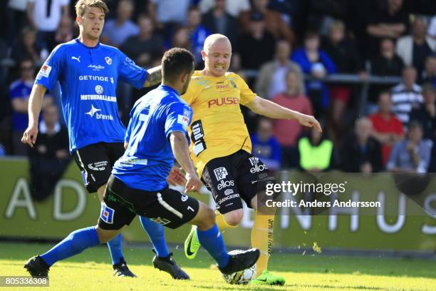 Marcus Mathisen and Nikolai Alho of Halmstad BK competes with Simon Lundevall of IF Elfsborg for the ball during the Allsvenskan match between...