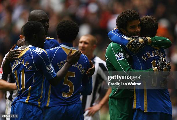 David James of Portsmouth hugs Hermann Hreidarsson of Portsmouth at the final whistle during the FA Cup sponsored by E.ON Semi-Final match between...