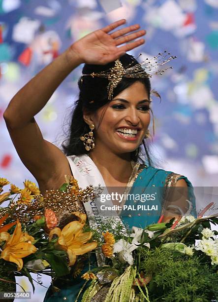 Newly crowned beauty pageant entrant Miss India World Parvathy Omanakuttan waves after winning the Miss India pageant contest on April 5, 2008 in...