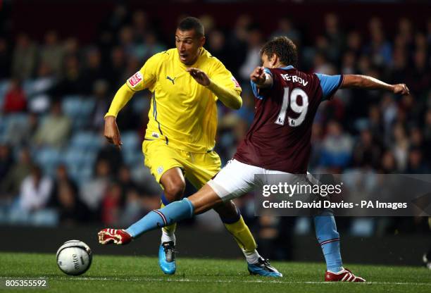 Cardiff City's Jay Bothroyd and Aston Villa's Stiliyan Petrov battle for the ball during the Carling Cup Third Round match at Villa Park, Birmingham.