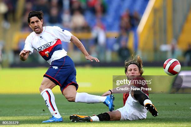 Philippe Mexes of Roma tackles Marco Borriello of Genoa during the Serie A match between Torino and Roma at the Stadio Olimpico on April 05, 2008 in...
