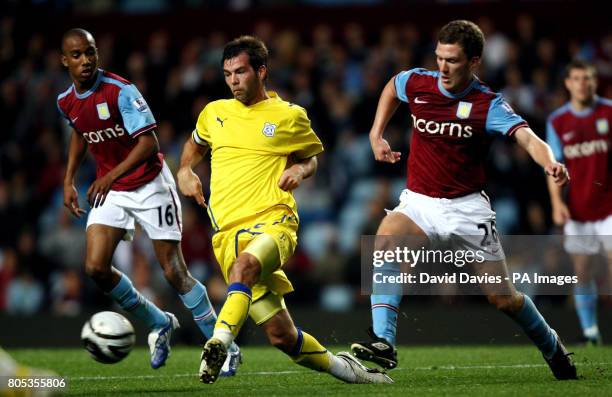 Cardiff City's Joe Ledley gets away from the challenge of Aston Villa's during the Carling Cup Third Round match at Villa Park, Birmingham.