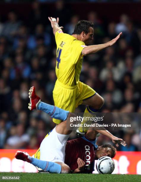 Aston Villa's Stiliyan Petrov is tackled by Cardiff City's Gavin Rae during the Carling Cup Third Round match at Villa Park, Birmingham.