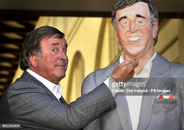Sir Terry Wogan is presented with a life-size cake replica of himself in the Covent Garden Piazza, London, to mark his 30th anniversary of presenting...
