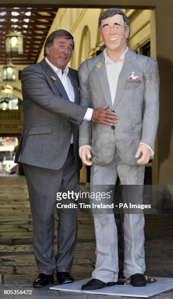 Sir Terry Wogan is presented with a life-size cake replica of himself in the Covent Garden Piazza, London, to mark his 30th anniversary of presenting...