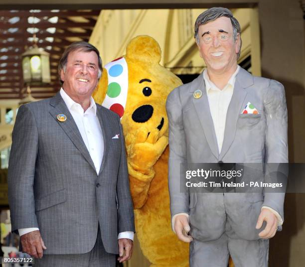 Sir Terry Wogan is presented with a life-size cake replica of himself in the Covent Garden Piazza, London, to mark his 30th anniversary of presenting...