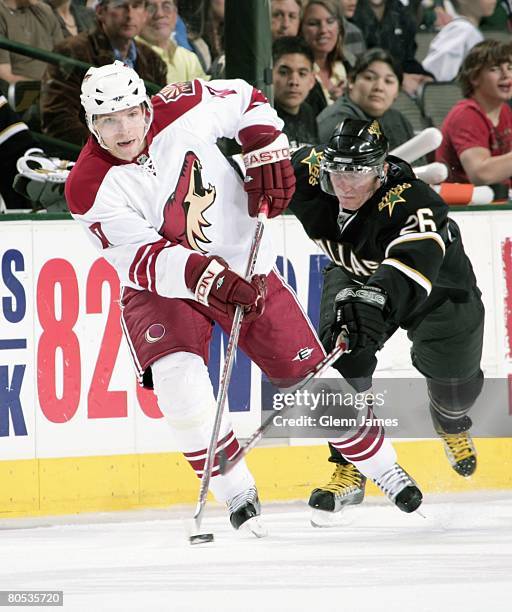 Radim Vrbata of the Phoenix Coyotes makes a pass to a teammate against Jere Lehtinen of the Dallas Stars at the American Airlines Center on April 4,...