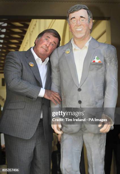 Sir Terry Wogan is presented with a life-size cake replica of himself in the Covent Garden Piazza, London, to mark his 30th anniversary of presenting...