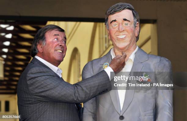 Sir Terry Wogan is presented with a life-size cake replica of himself in the Covent Garden Piazza, London, to mark his 30th anniversary of presenting...