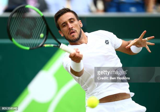 Damir Dzumhur of Bosnia and Herzegovina hits a forehand during his match against Thanasi Kokkinakis of Australia day five of The Boodles Tennis Event...