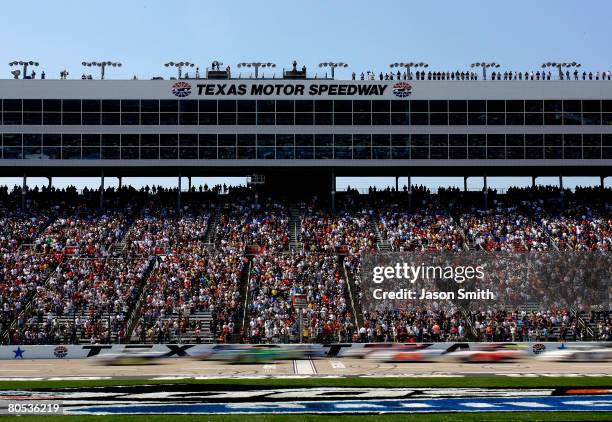 Kevin Harvick, driver of the Roadloans.com Chevrolet, leads the field to the start of the NASCAR Nationwide Series O'Reilly 300 at Texas Motor...