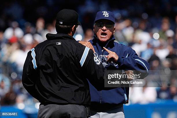 Manager Joe Maddon of the Tampa Bay Rays argues with second base umpire James Hoye during the game against the New York Yankees at Yankee Stadium...