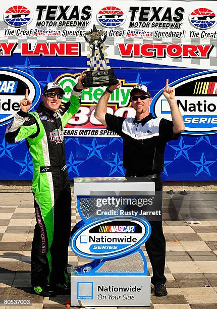 Kyle Busch, driver of the DLP HDTV Toyota, celebrates with crew chief Jason Ratcliff, after winning the NASCAR Nationwide Series O'Reilly 300 at...