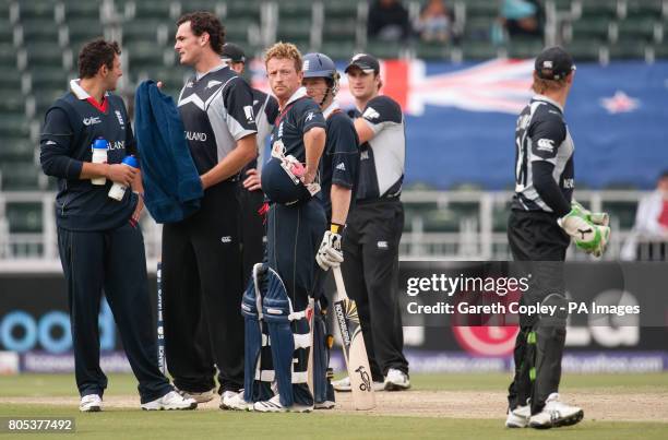 England's Paul Collingwood with New Zealand wicket keeper Brendon McCullum after he was given 'run out' by the 3rd umpire, New Zealand captain Daniel...