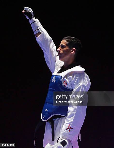 Mark Lopez celebrates after defeating Chris Martinez during the Taekwando Olympic Trials at the Veterans Memorial Auditorium on April 5, 2008 in Des...