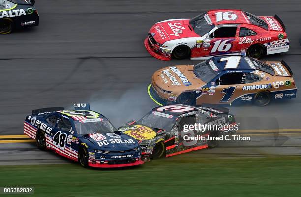 Brennan Poole, driver of the DC Solar Chevrolet, and Ty Dillon, driver of the Bass Pro Shops/TRCKR BTS Chevrolet, are involved in an on-track...