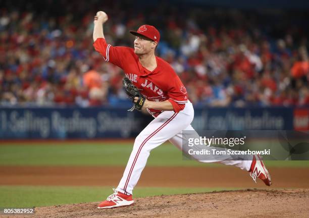 Lucas Harrell of the Toronto Blue Jays delivers a pitch in the seventh inning during MLB game action against the Boston Red Sox at Rogers Centre on...