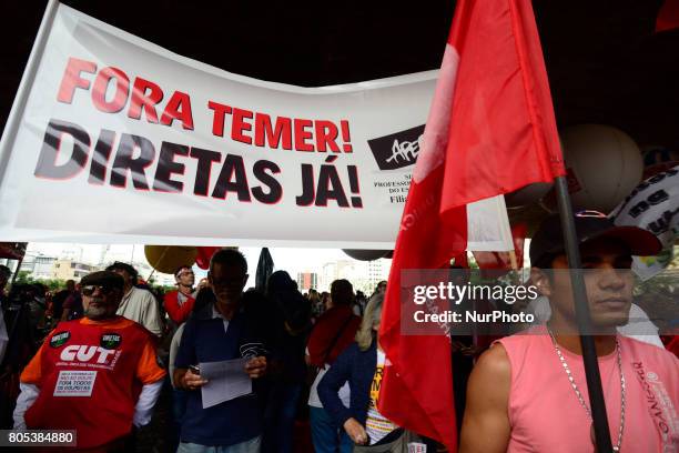 Members of the Roofless Movement call for Brazilian President Michel Temer to step down and protest against his proposed economic reforms, at...