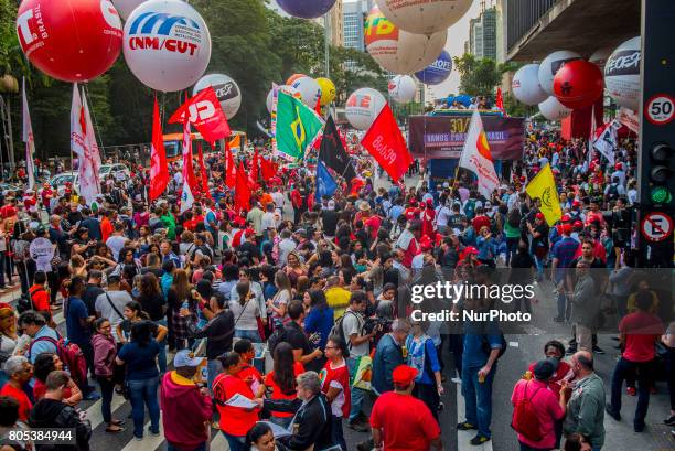 Members of the Roofless Movement call for Brazilian President Michel Temer to step down and protest against his proposed economic reforms, at...