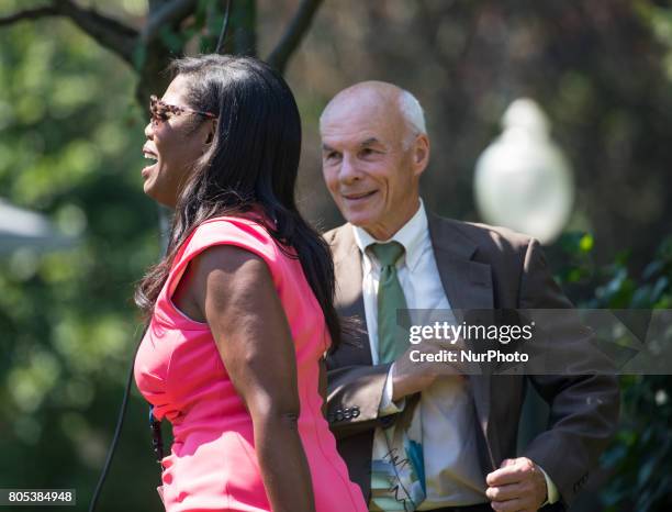 Omarosa Manigault, director of communications for the Office of Public Liaison for President Trump, shares a laught with White House usher Daniel...